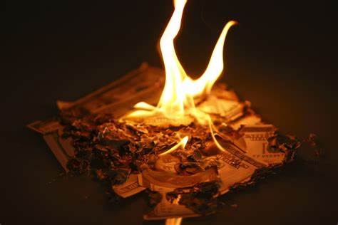 is it illegal to burn money?